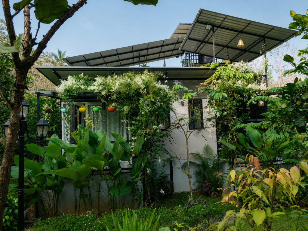 Container Home Vibes surrounded by a lush garden in Kerala